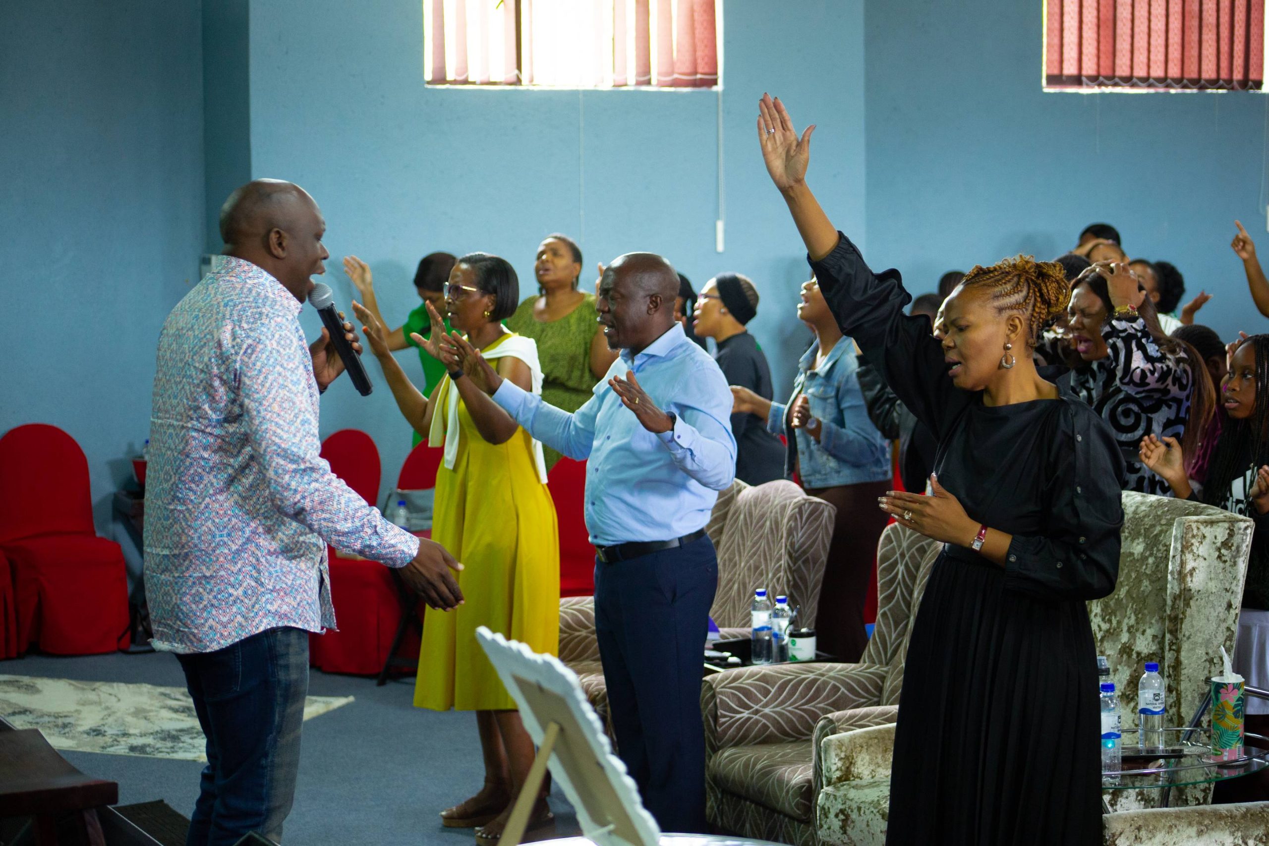 man holding his hands on open book